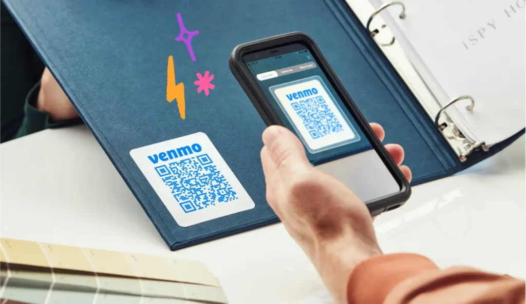 Person scanning a venmo QR code to make a payment