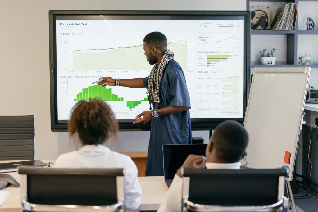 Man doing a presentation to work colleagues at a conference room