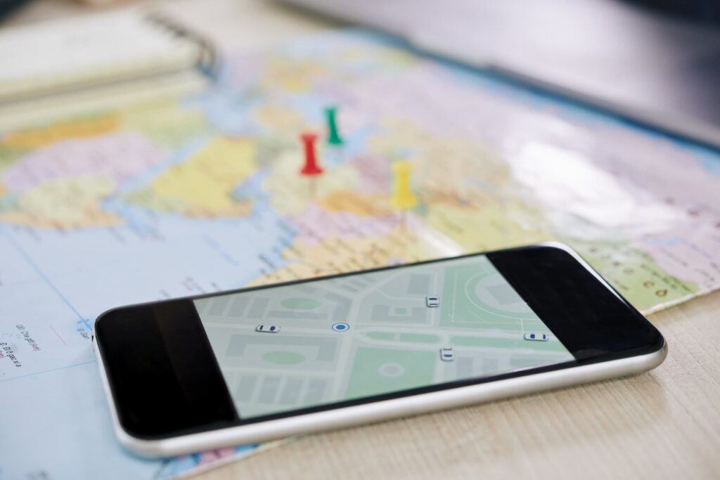 iPhone on a map with a navigation app activated