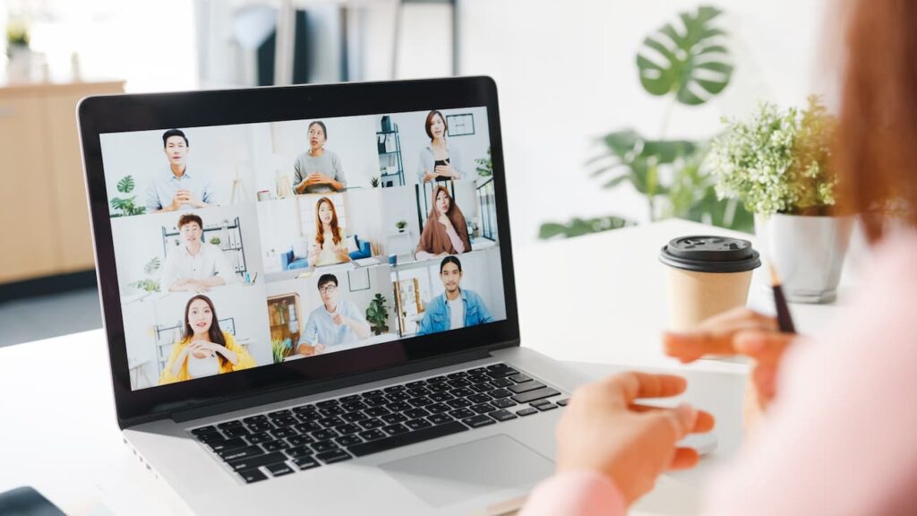 Several people on a video conference chatting with woman