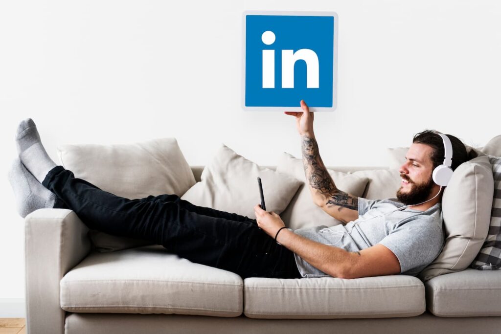 Person using LinkedIn while on a couch